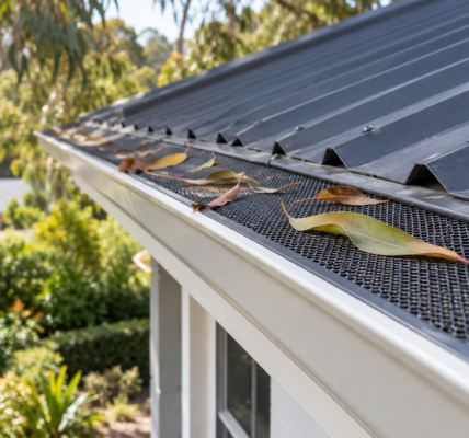 Protective mesh fitted along a house gutter